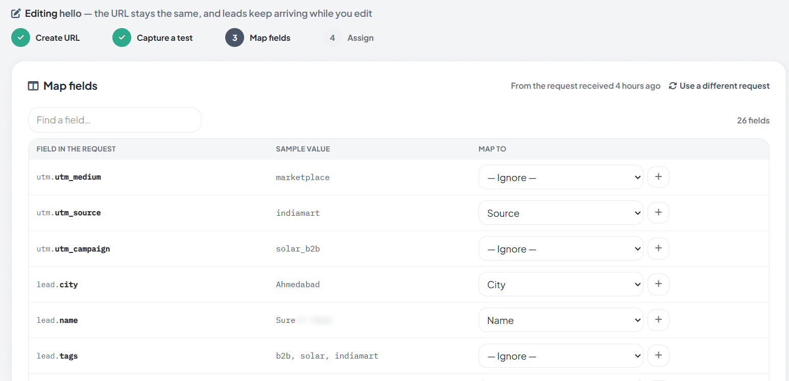 RMDialer Custom Webhook, Map fields step: each field in the received request with a sample value, such as utm.utm_source indiamart mapped to Source, lead.city Ahmedabad mapped to City and lead.name mapped to Name, with 26 fields found