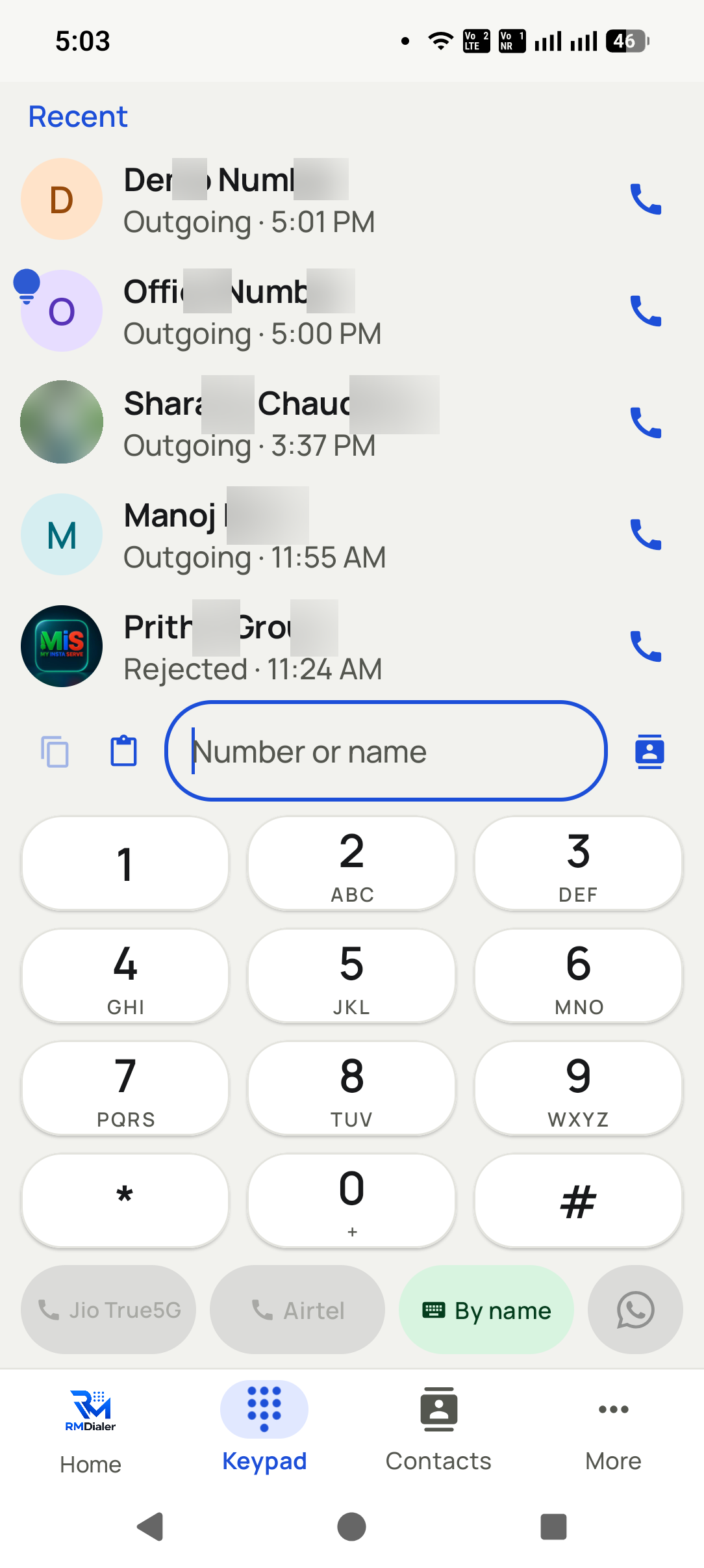 Dial from the keypad and pick the SIM in the RMDialer app: Recent calls sit above the keypad, and buttons for each SIM let the call go out on the right line.